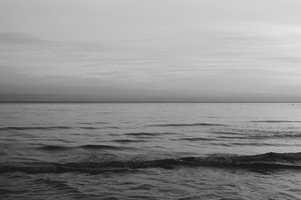 grayscale photo of ocean waves