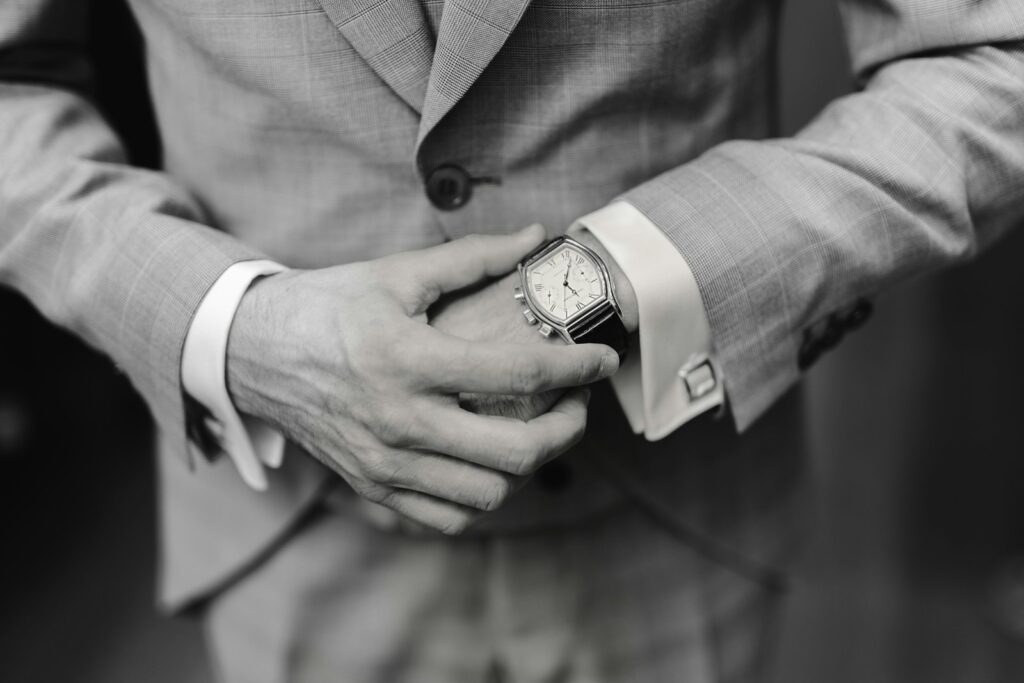 man in gray suit jacket wearing black analog watch