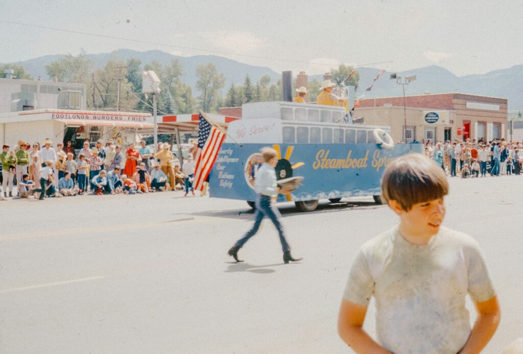 A young boy standing in the middle of a street